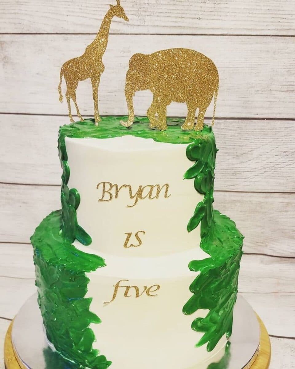 Safari jungle 5th birthday cake with gold animal toppers