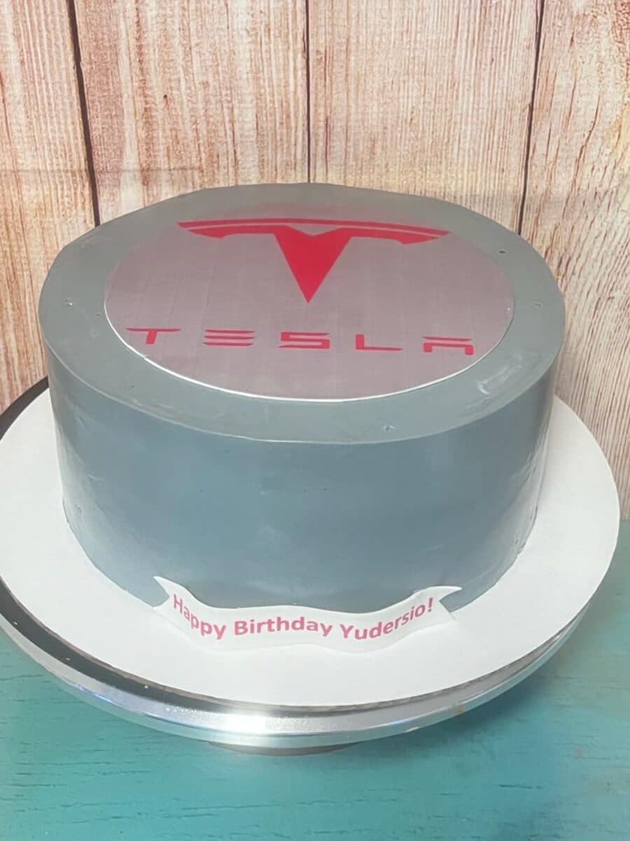 Custom gray birthday cake with car logo