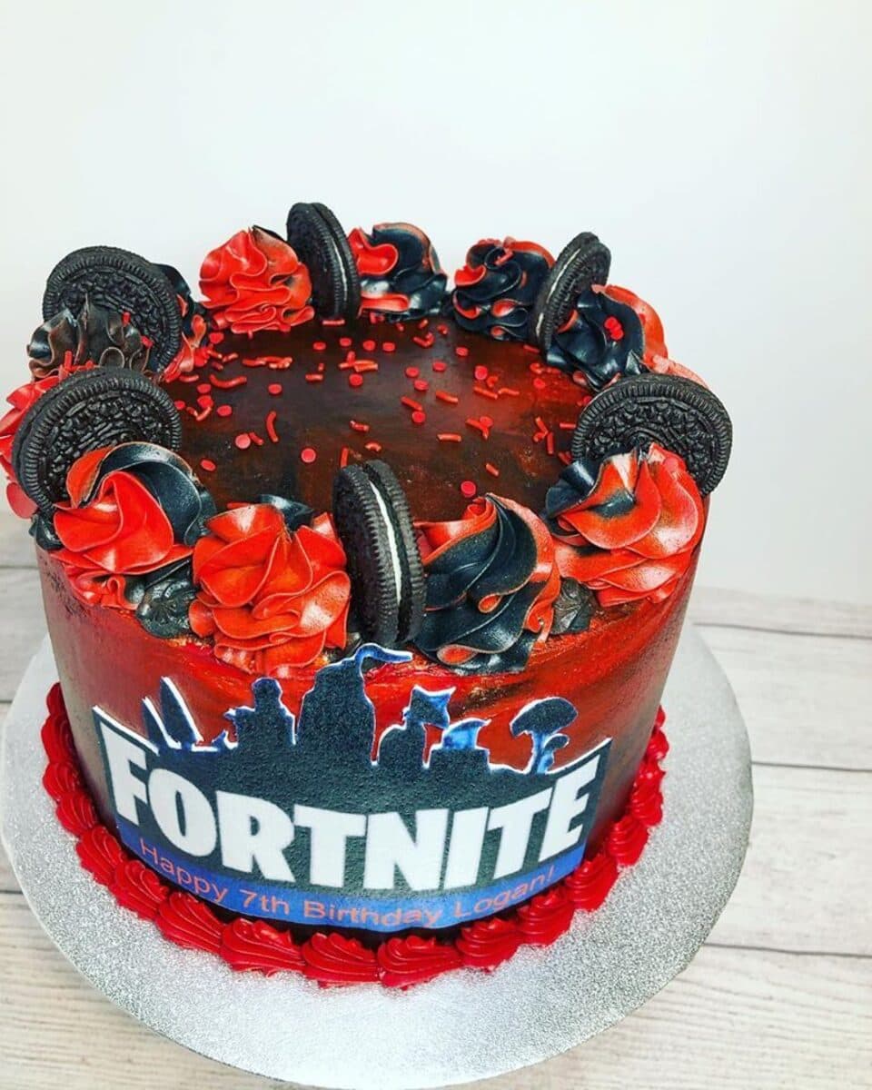 Video-game themed birthday cake with cookies and red drip