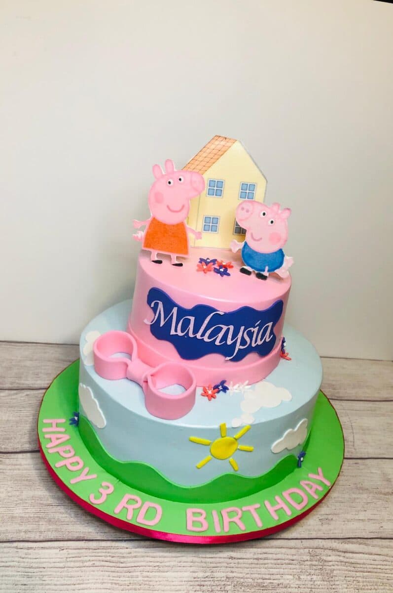 Cartoon pig themed pink tiered 3rd birthday cake