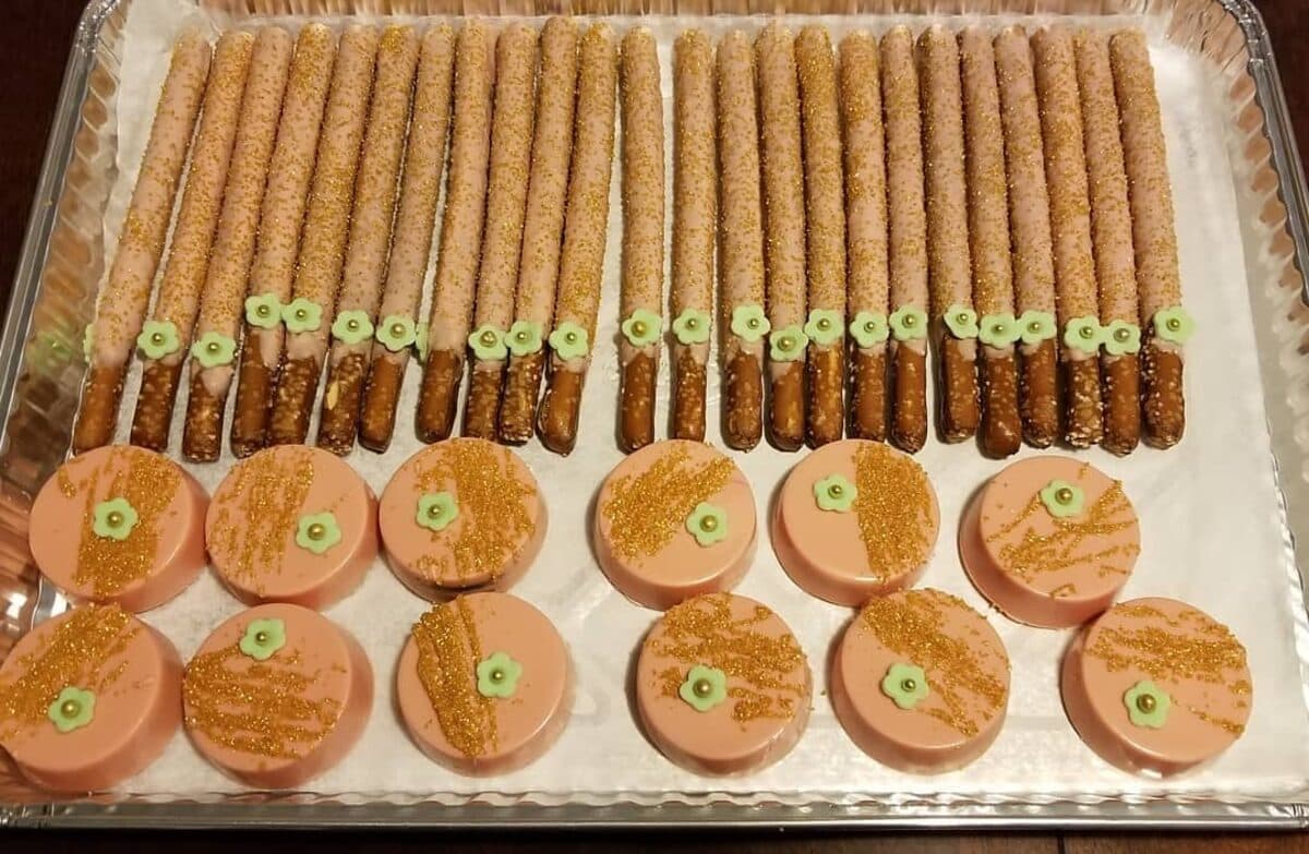 Chocolate-dipped pretzel rods and covered sandwich cookies